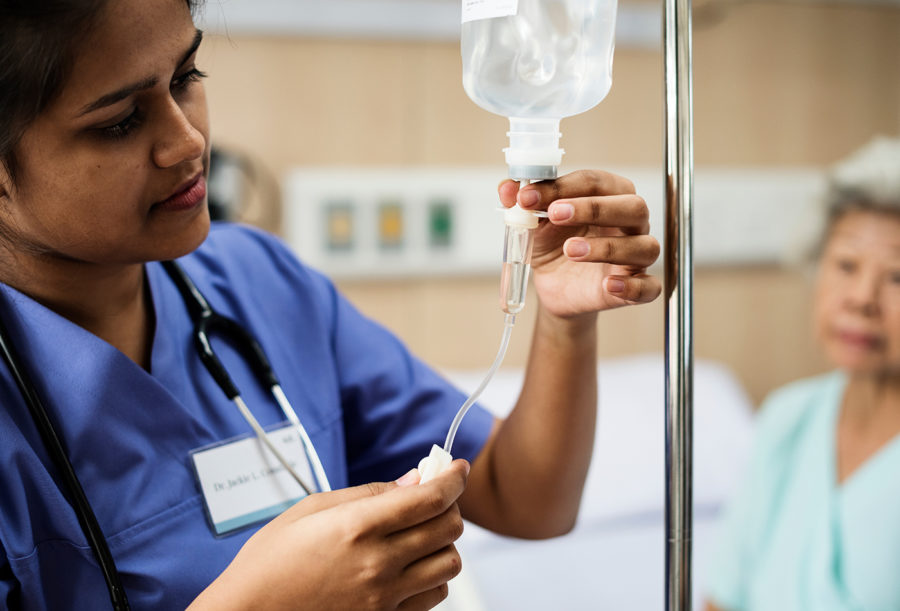 Nurse Taking Care Of An Old Patient