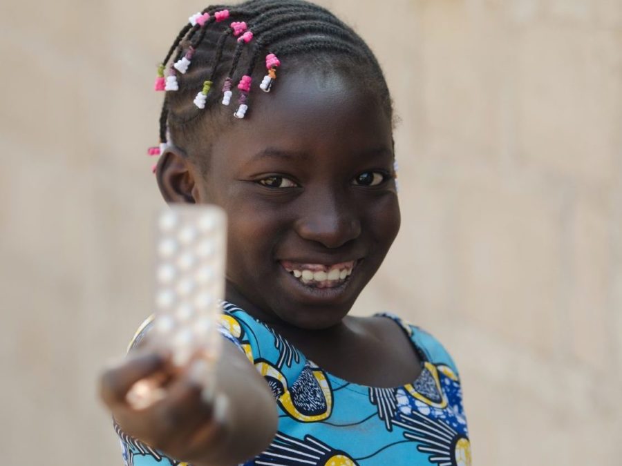 Portrait Shot Of African Black Girl With Medicine